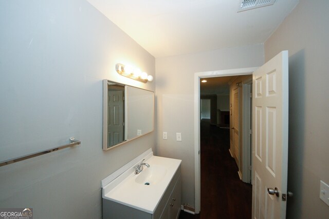 bathroom featuring wood-type flooring and vanity