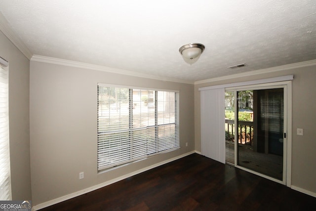 unfurnished room with ornamental molding, a textured ceiling, a healthy amount of sunlight, and dark hardwood / wood-style flooring