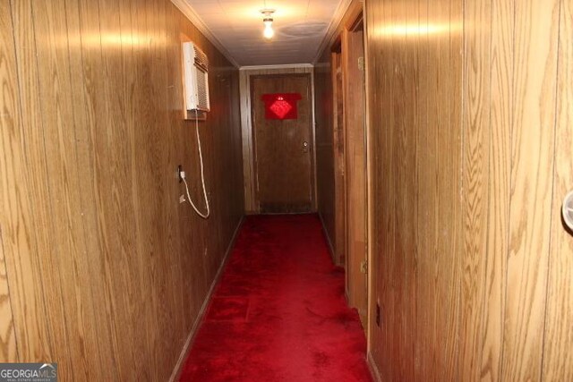 hallway with carpet and wooden walls