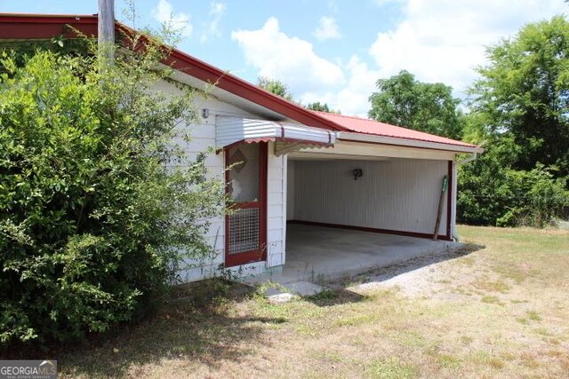 view of side of home with a lawn