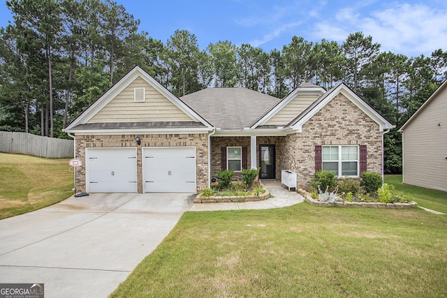 craftsman-style home featuring a garage and a front yard