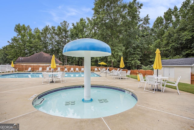 view of swimming pool featuring a patio