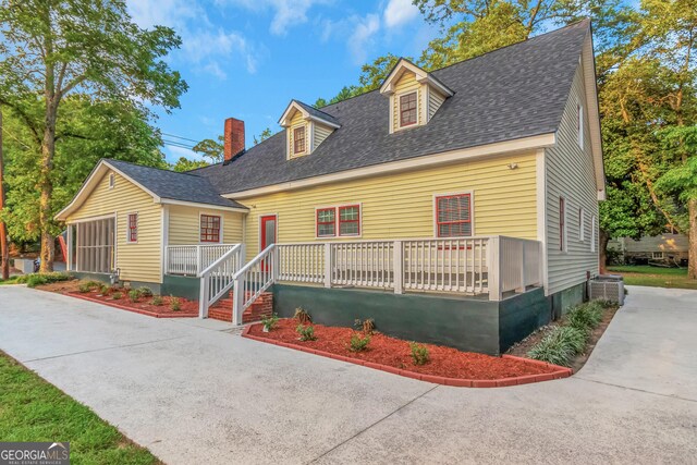 cape cod home with central air condition unit