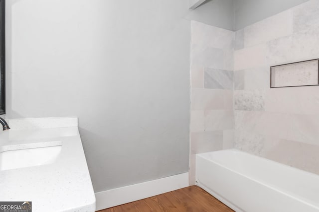 full bath with vanity and wood finished floors