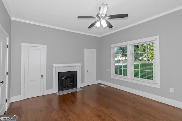 unfurnished living room featuring a fireplace with flush hearth, baseboards, wood finished floors, and crown molding