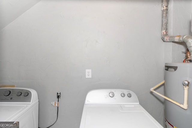 washroom featuring laundry area, gas water heater, and washing machine and clothes dryer