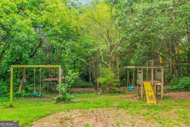 view of play area with a wooded view