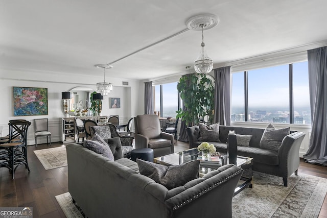 living area featuring dark wood-style flooring and a city view