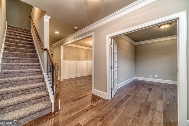 interior space featuring hardwood / wood-style flooring and crown molding