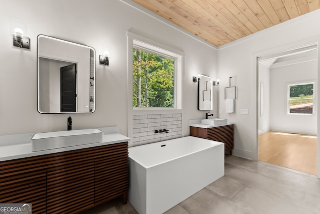 bathroom with a bathing tub, ornamental molding, vanity, wood ceiling, and hardwood / wood-style flooring