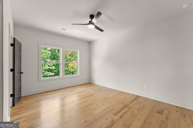 unfurnished room with ceiling fan and light hardwood / wood-style flooring