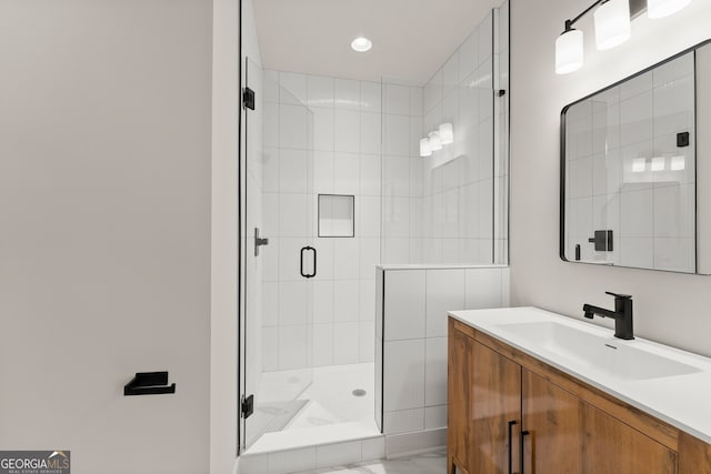 bathroom with vanity and an enclosed shower