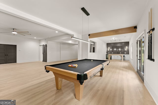 recreation room with light wood-type flooring, beamed ceiling, ceiling fan, and pool table