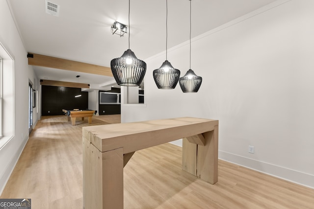 interior space with pool table, light wood-type flooring, and beam ceiling