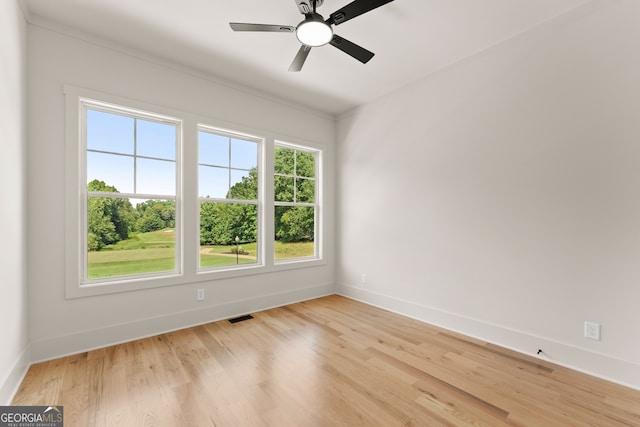 unfurnished room featuring light hardwood / wood-style flooring and ceiling fan