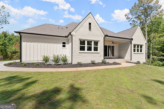 exterior space with ceiling fan, a yard, and a patio