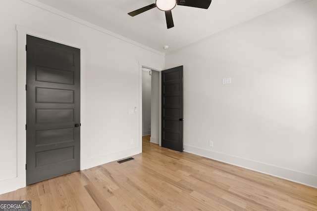 interior space with ceiling fan and light hardwood / wood-style flooring