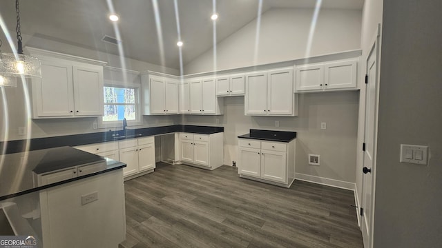 kitchen featuring sink, decorative light fixtures, high vaulted ceiling, dark hardwood / wood-style floors, and white cabinetry