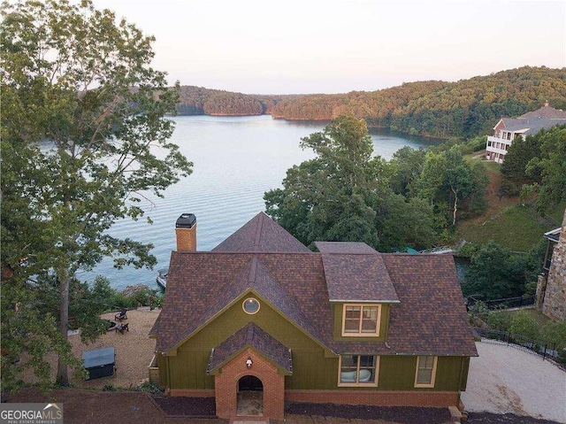 aerial view at dusk with a water view