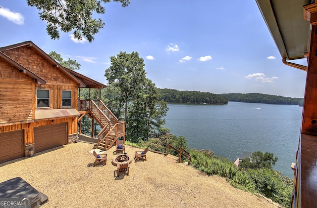 view of water feature with an outdoor fire pit