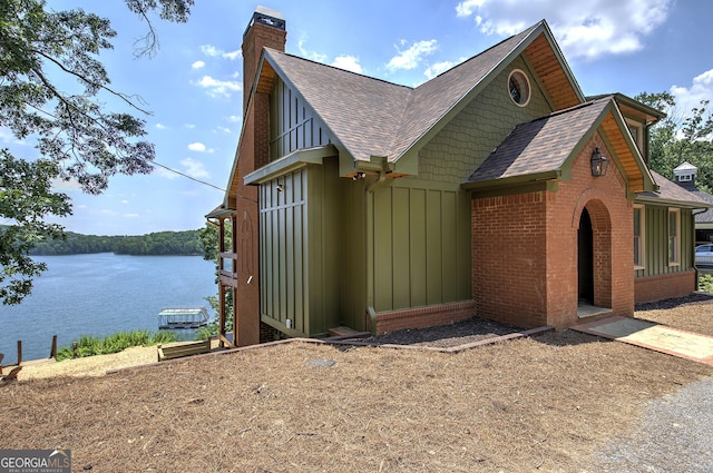 view of side of property with a water view