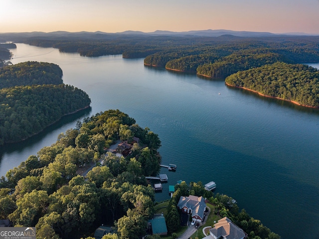 aerial view at dusk with a water and mountain view