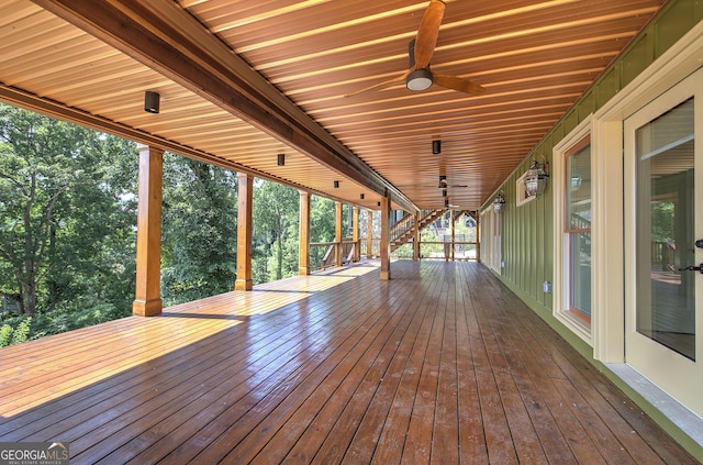 wooden deck featuring ceiling fan