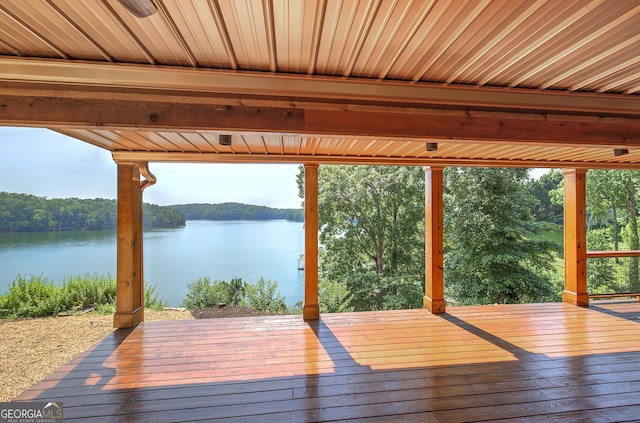 dock area with a deck with water view