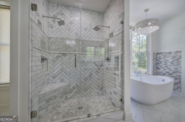 bathroom featuring plus walk in shower and tile walls