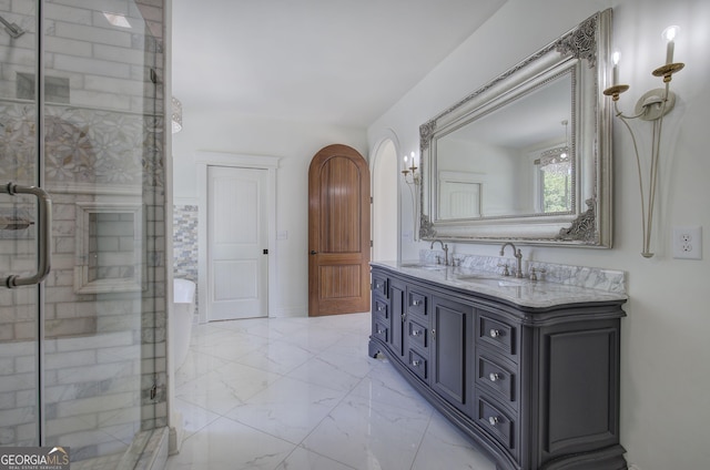 bathroom featuring vanity and an enclosed shower