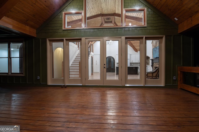 interior space featuring lofted ceiling, wood ceiling, and dark hardwood / wood-style floors