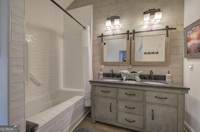 bathroom with shower / bathtub combination with curtain, vanity, and wooden walls