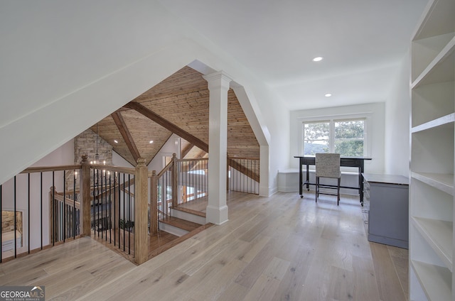 interior space with vaulted ceiling with beams, wooden ceiling, and light hardwood / wood-style flooring