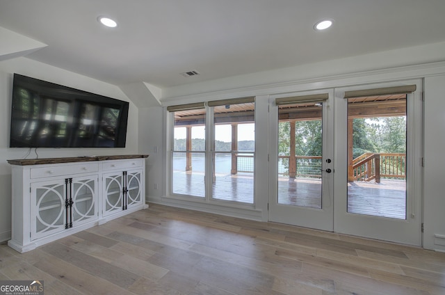 entryway featuring plenty of natural light and light hardwood / wood-style floors