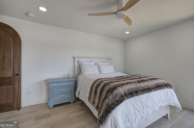 bedroom featuring ceiling fan and light wood-type flooring