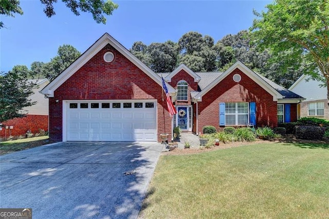 view of front facade featuring a garage and a front lawn