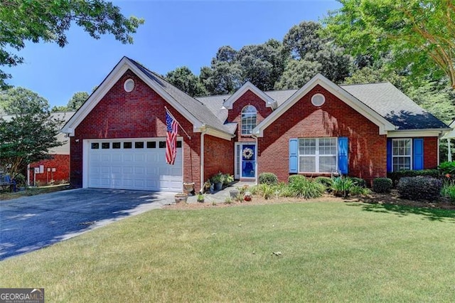 view of front of house with a garage and a front lawn