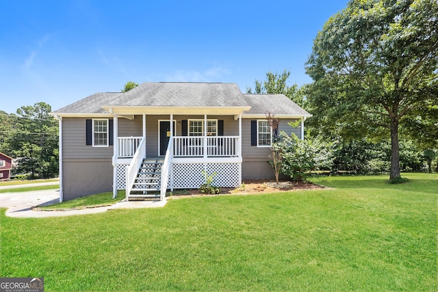 view of front facade featuring covered porch and a front yard