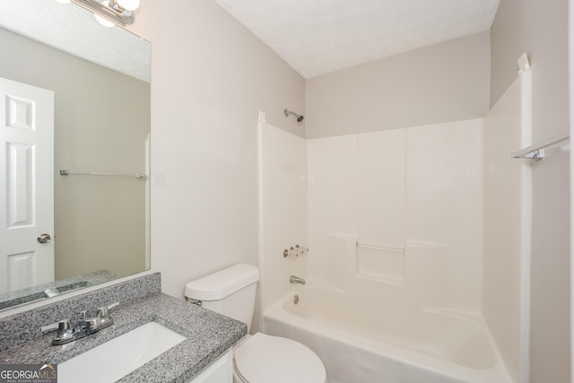 full bathroom with vanity, toilet, shower / tub combination, and a textured ceiling