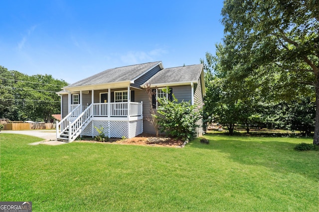 view of front of property featuring covered porch and a front yard