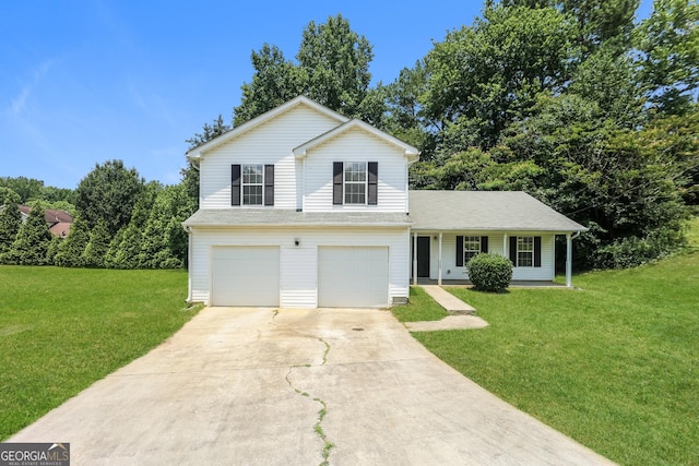 view of front of property featuring a front yard, a garage, and covered porch