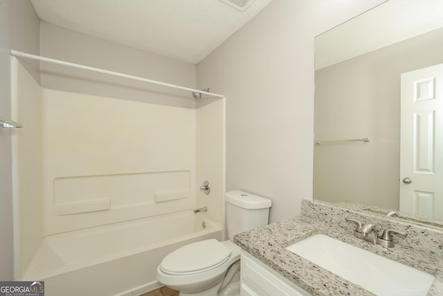 full bathroom featuring vanity, toilet, a textured ceiling, and bathing tub / shower combination