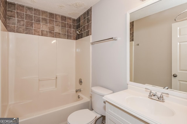 full bathroom with toilet, vanity, a textured ceiling, and tub / shower combination