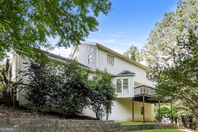 back of property with a balcony