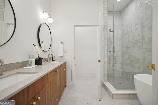 bathroom with vanity and independent shower and bath