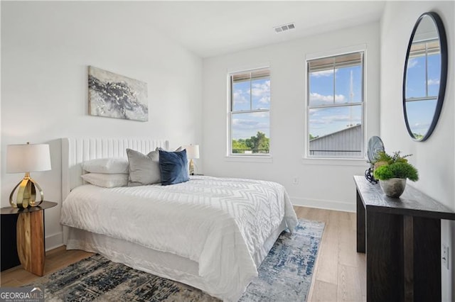 bedroom with light hardwood / wood-style flooring