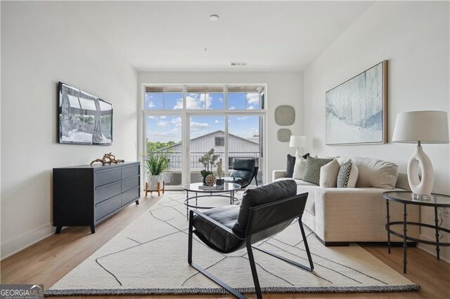 living room with light hardwood / wood-style floors