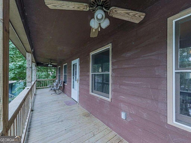 wooden terrace with ceiling fan