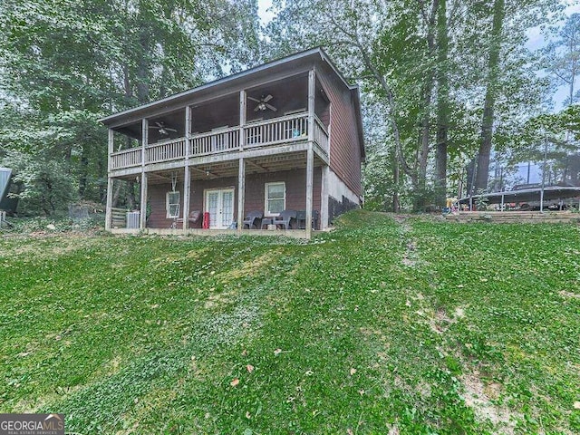 back of house featuring a patio area, a yard, and ceiling fan