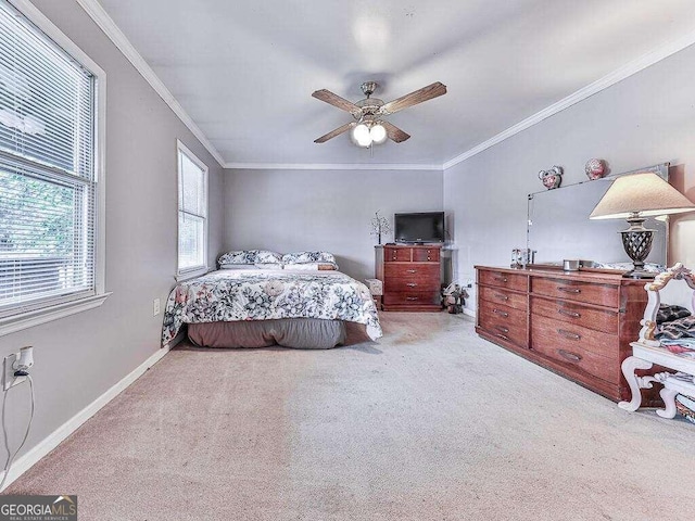 bedroom with ceiling fan, light colored carpet, and crown molding